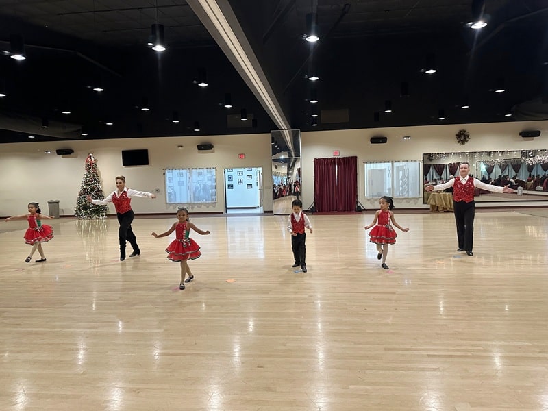 Child dancesport performance ChaCha Santa Tell Me